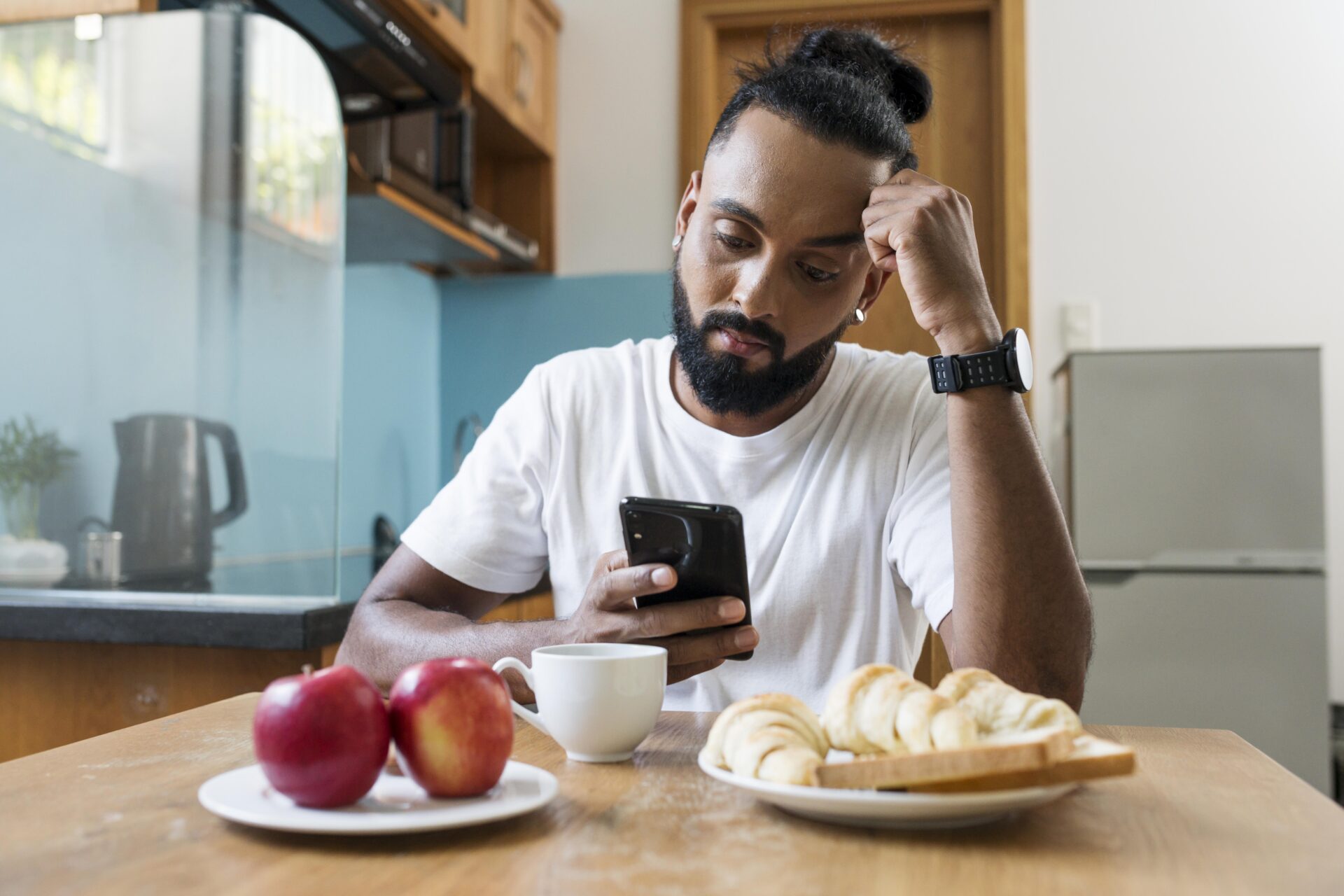 man-being-tired-while-taking-his-breakfast